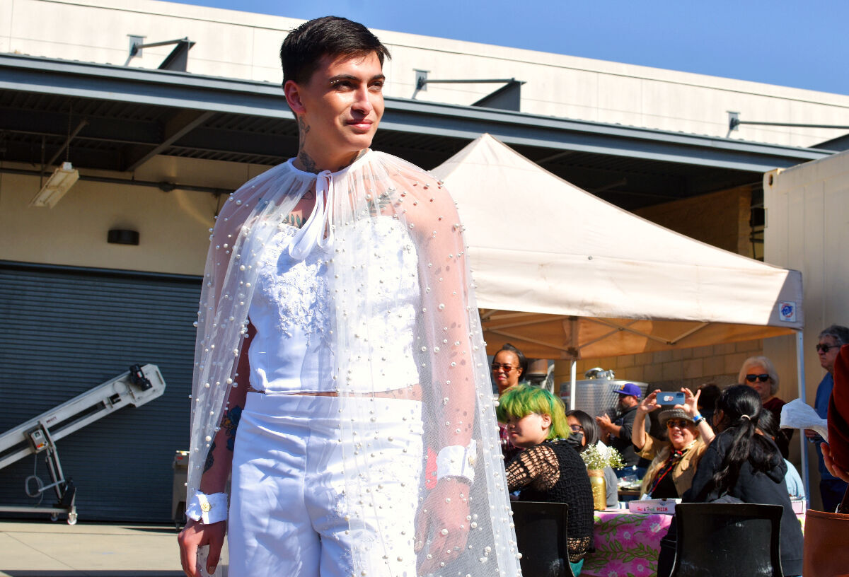 Vincent, the president of the fashion and design club shows off his outfit at Allan Hancock College.